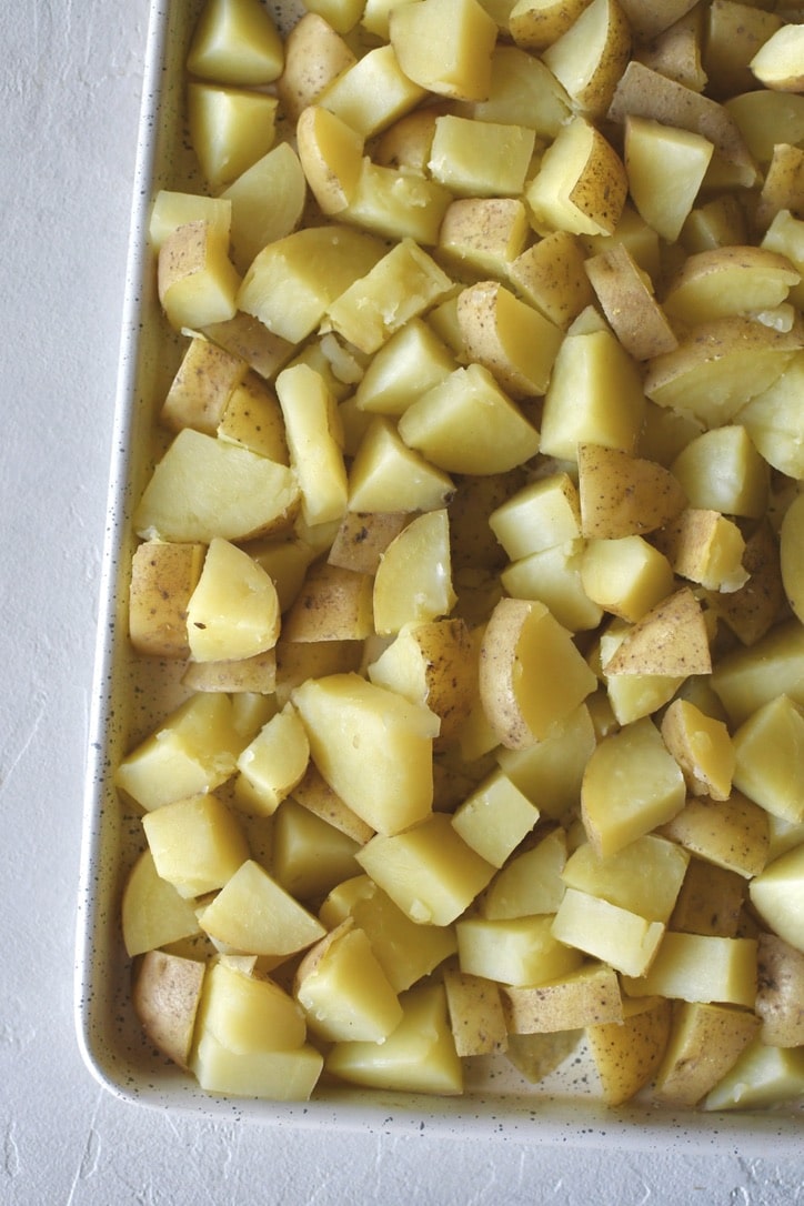 Boiled potatoes cooling a bit before adding the sauce.