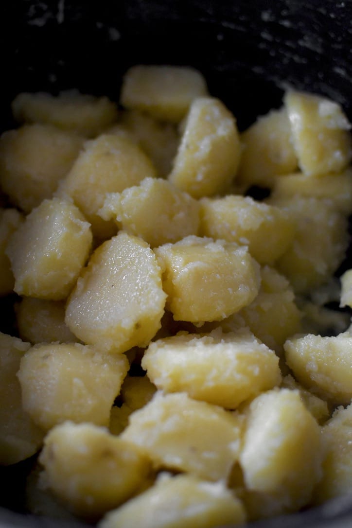 Cut potatoes after boiling seasoned with kosher salt and duck fat, and tossed around till "fuzzy"