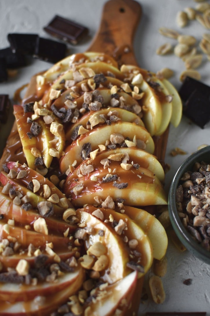 Apple Nachos on a cutting board, fully assembled and ready to eat.