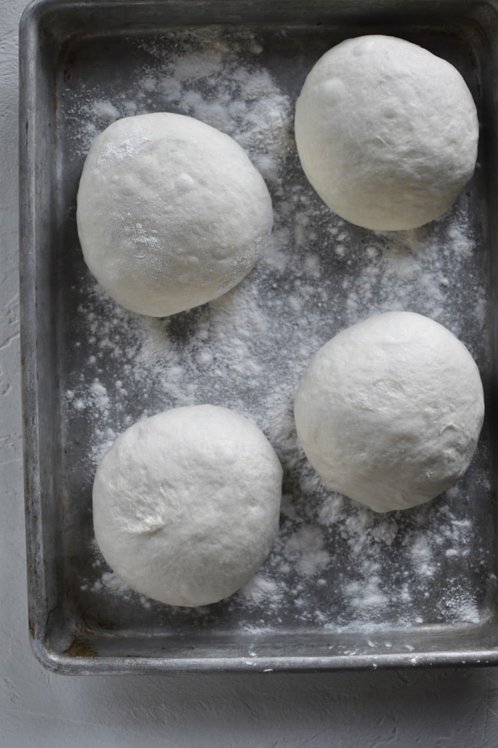 Portioned dough resting for a second rise.