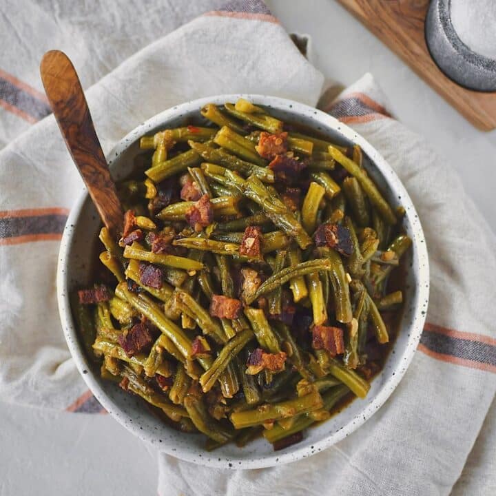 Southern Green Beans in a bowl with a spoon ready to be served.