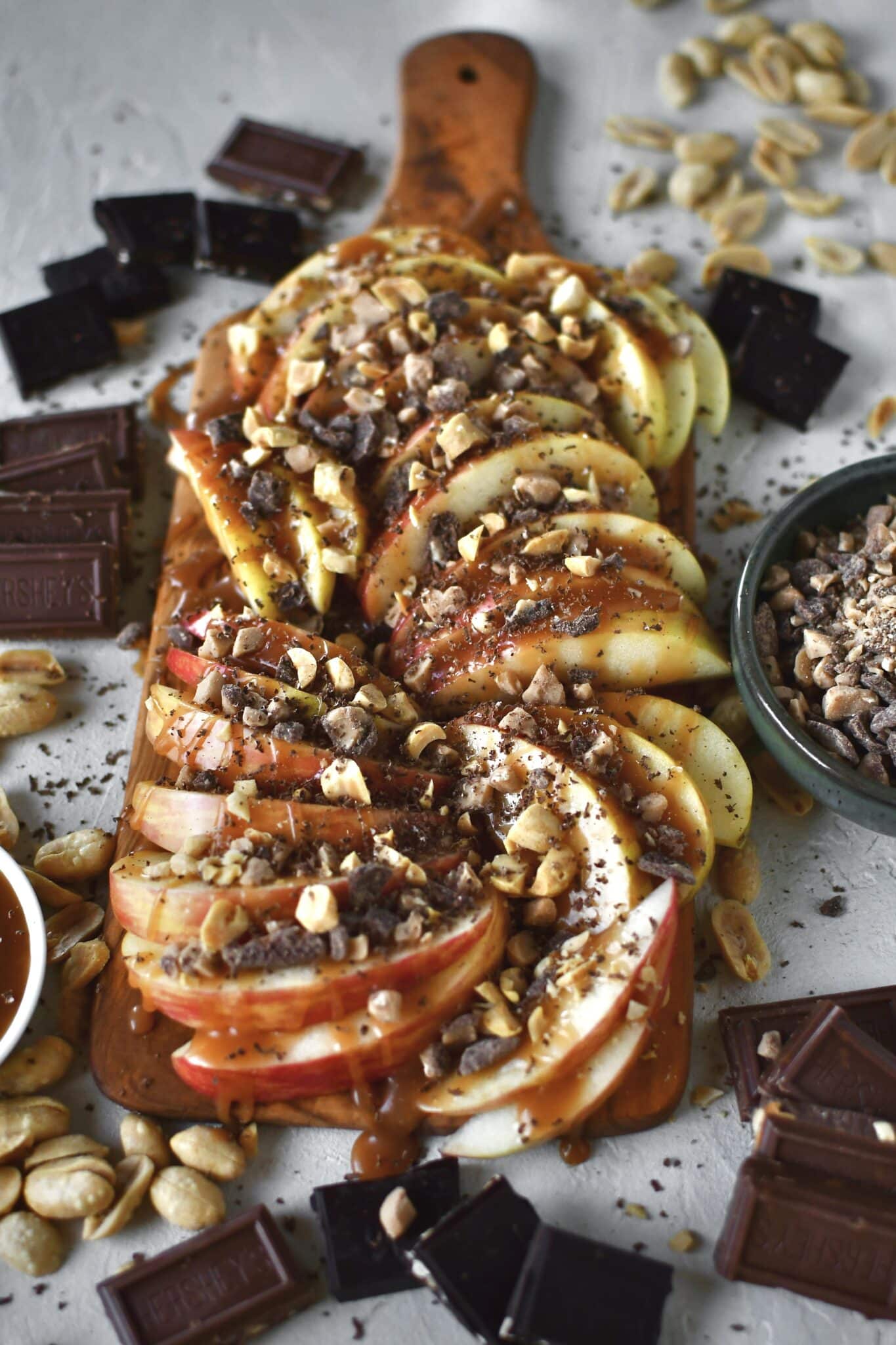 Apple Nachos on a cutting board, fully assembled and ready to eat.