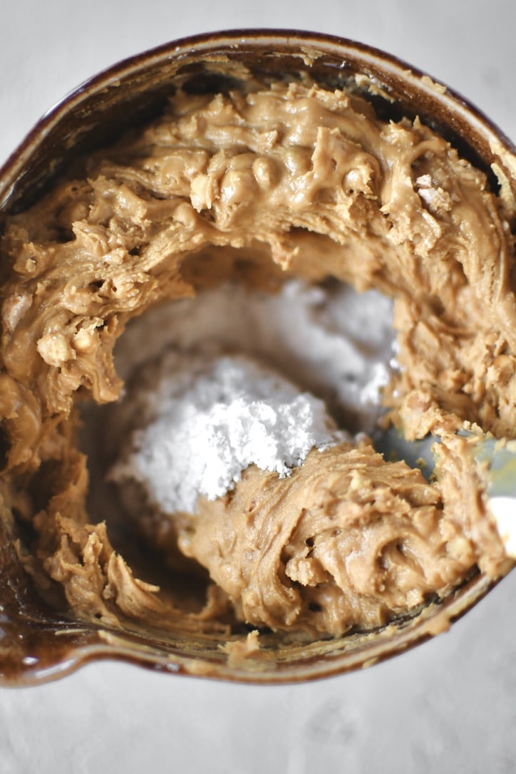 making the peanut butter filling by mixing the powdered sugar into the peanut butter.