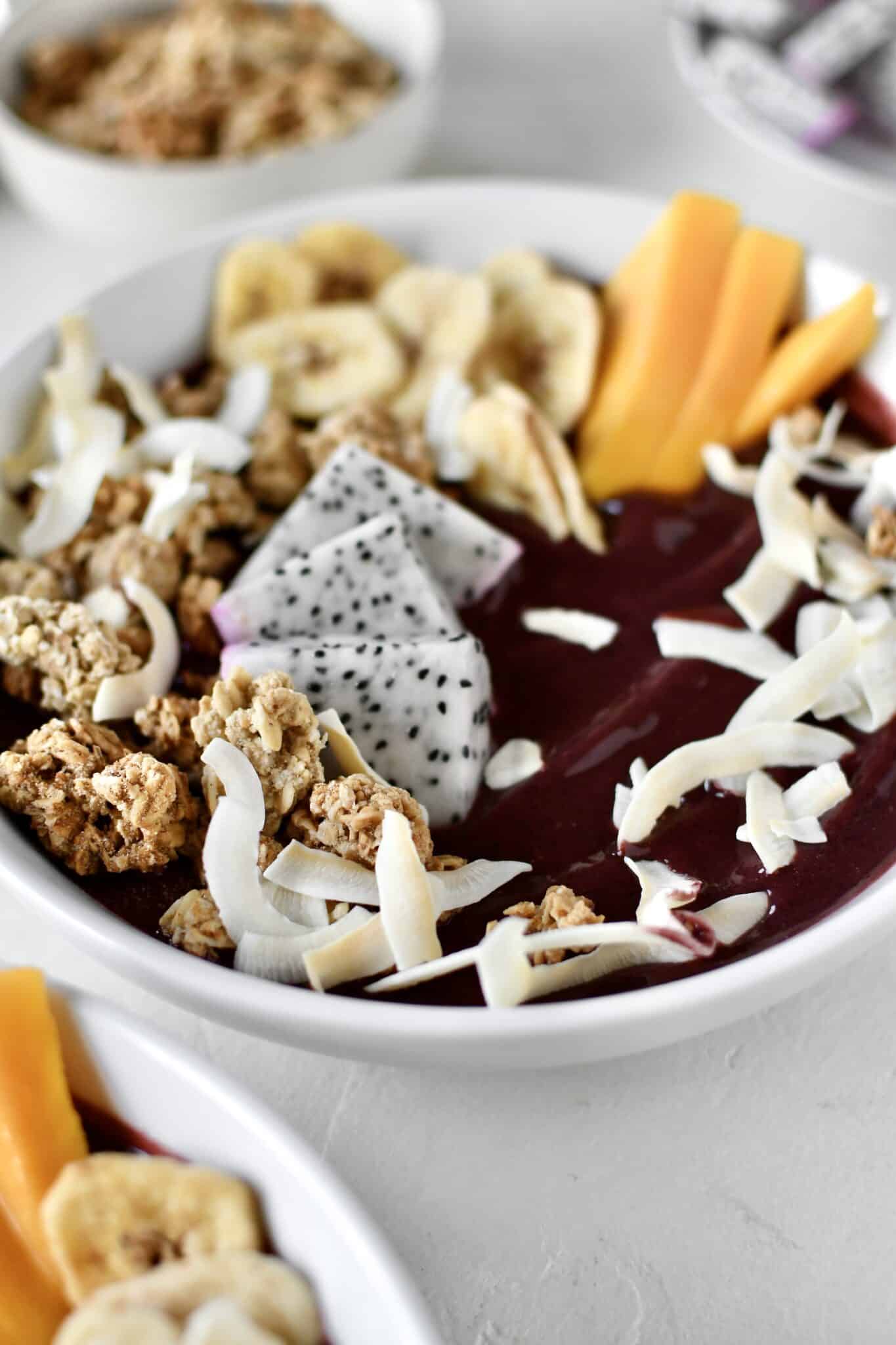 Smoothie Bowl, topped with fresh and dried fruit, ready to eat.
