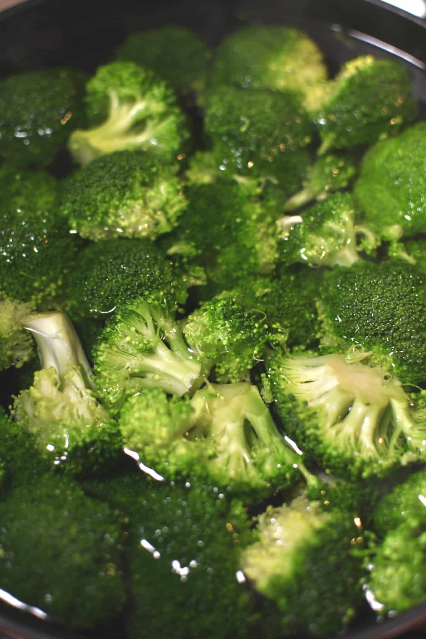 Broccoli added to boiling water to blanch for 1 minute.