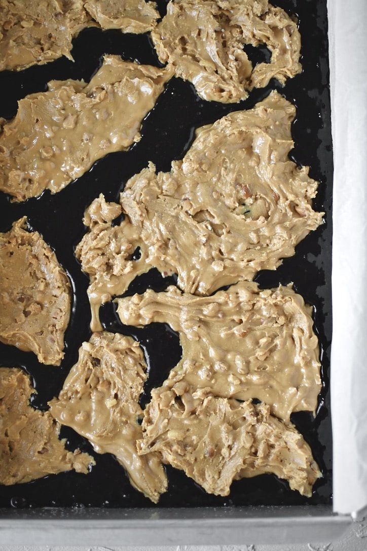 Topping half the brownie batter with the peanut butter filling.