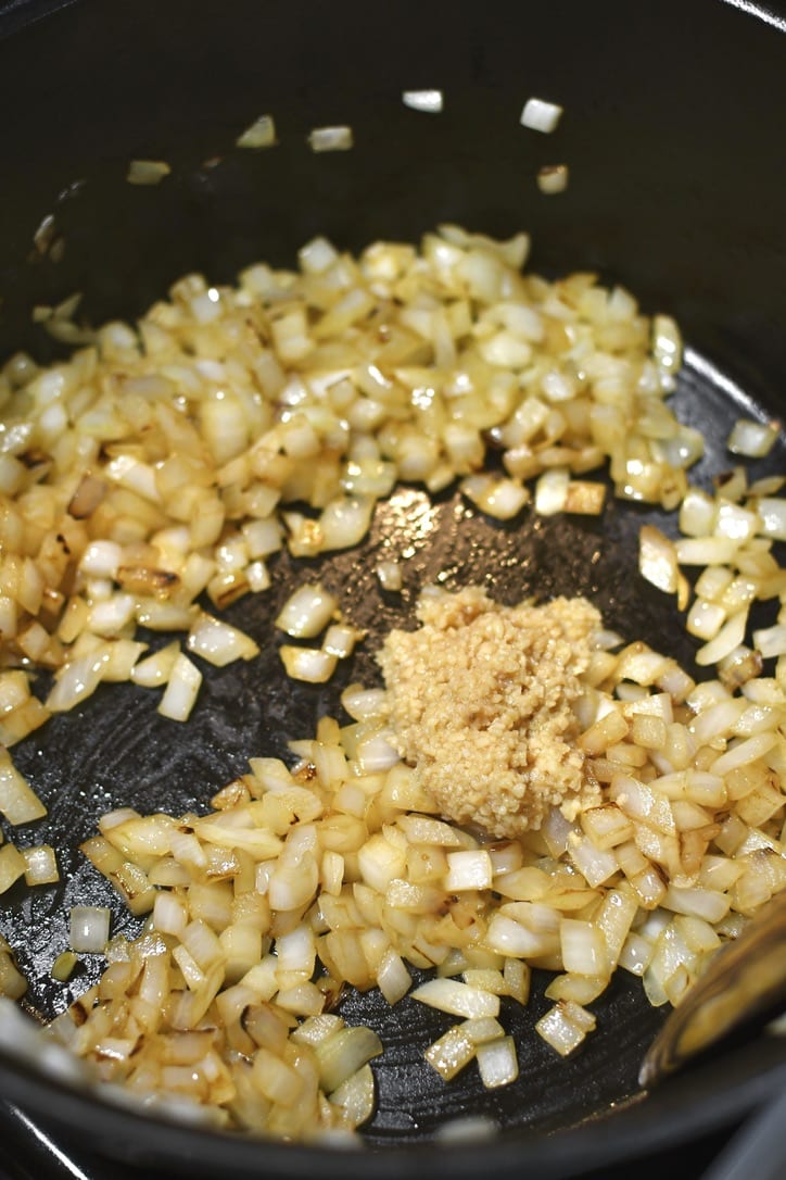 Onions sauteed in olive oil, adding the garlic to the pot.