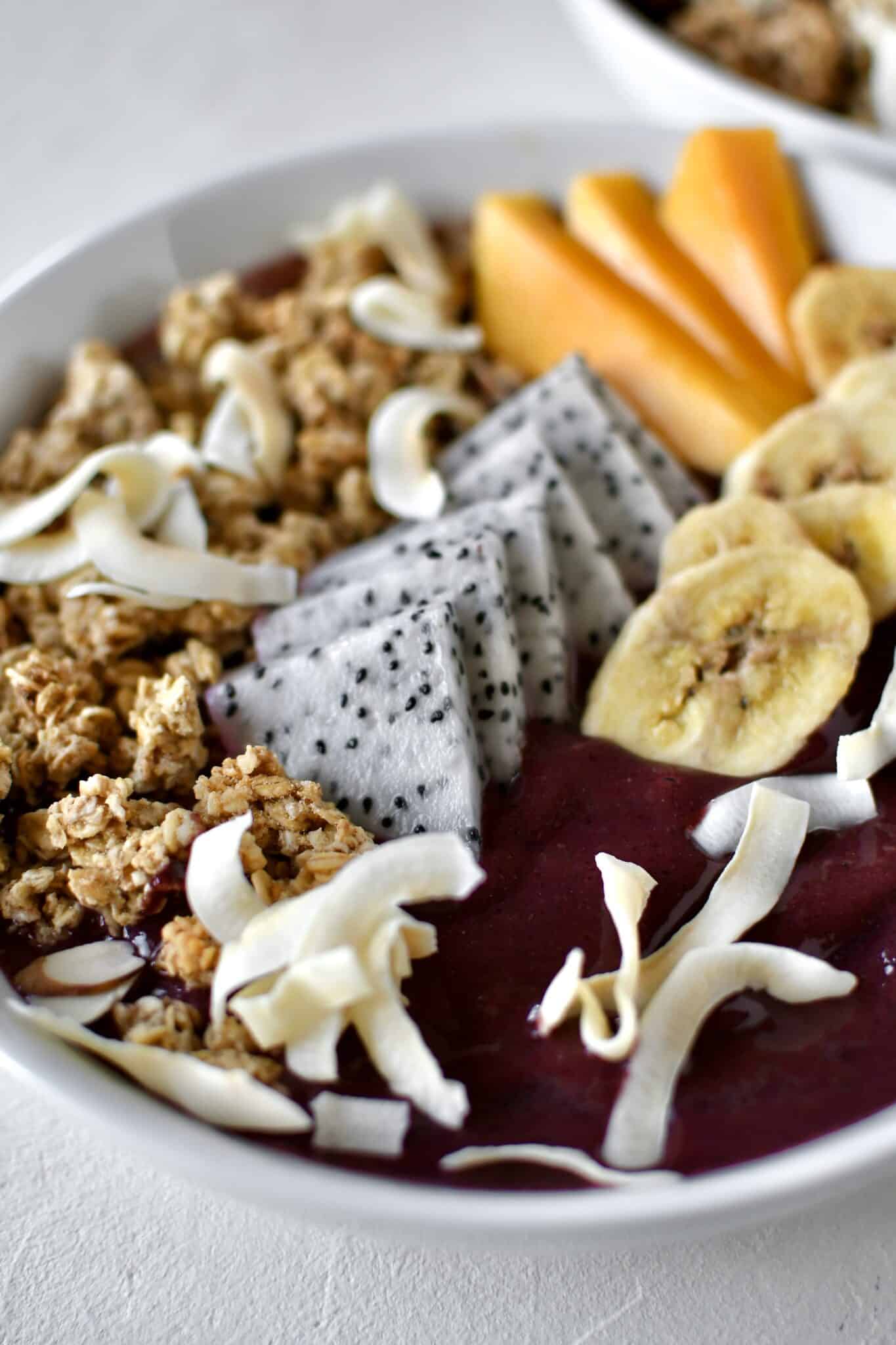 Smoothie Bowl, topped with fresh and dried fruit, ready to eat.