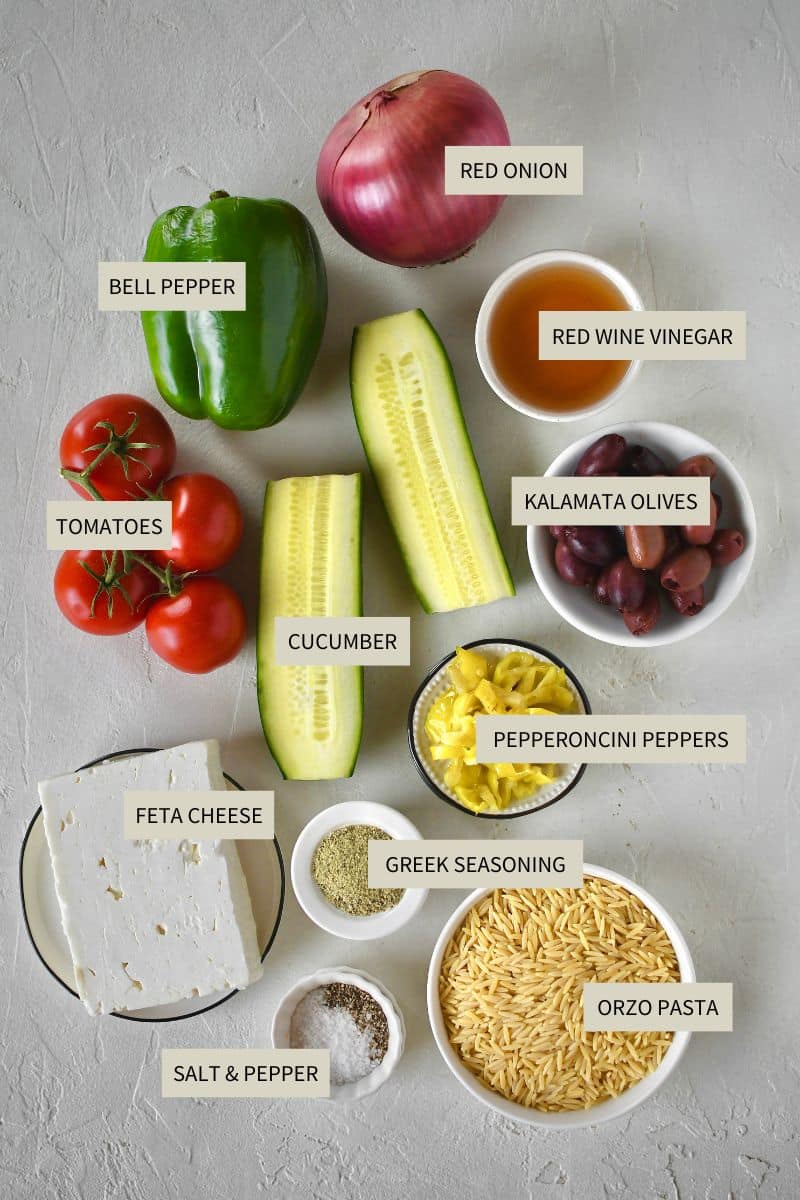 Ingredients needed to make Greek Pasta Salad.