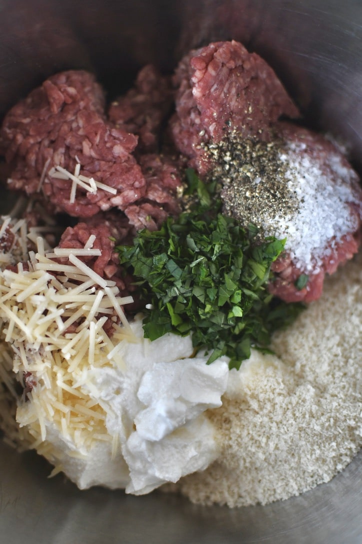 Ingredients for meatballs in a bowl before adding the cooked onions.