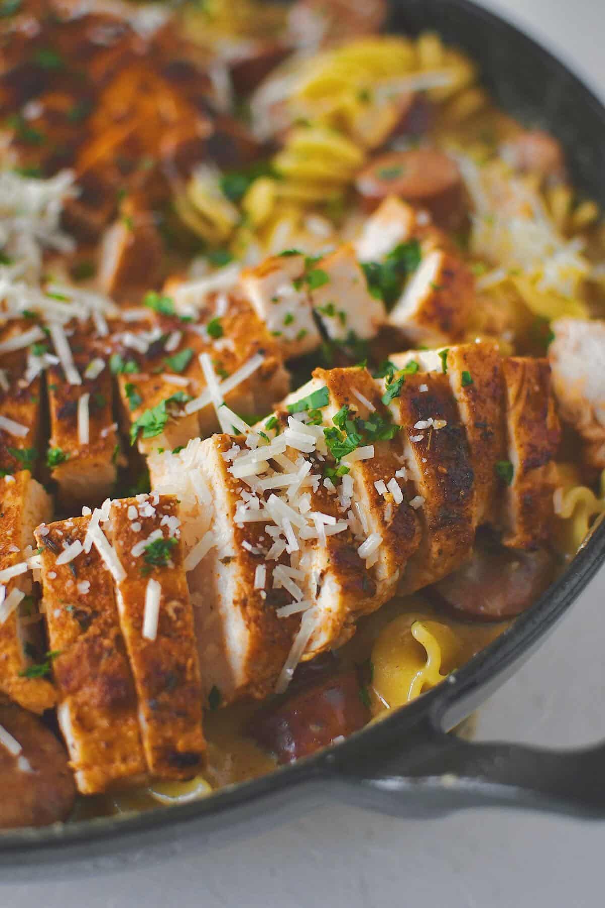 Cajun Chicken Alfredo finished in the pan with chicken on top.