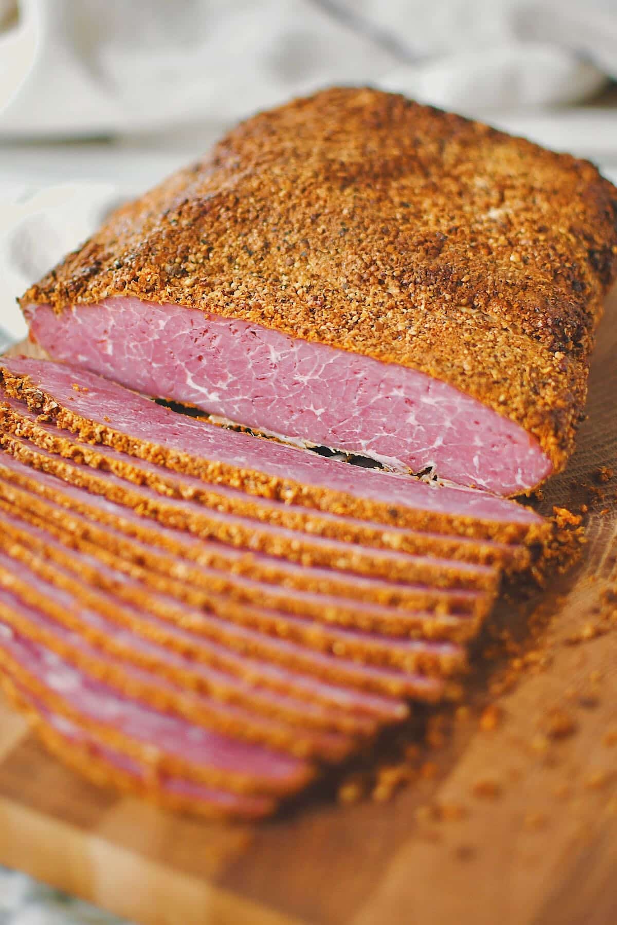 Slicing roasted and cooled homemade pastrami.