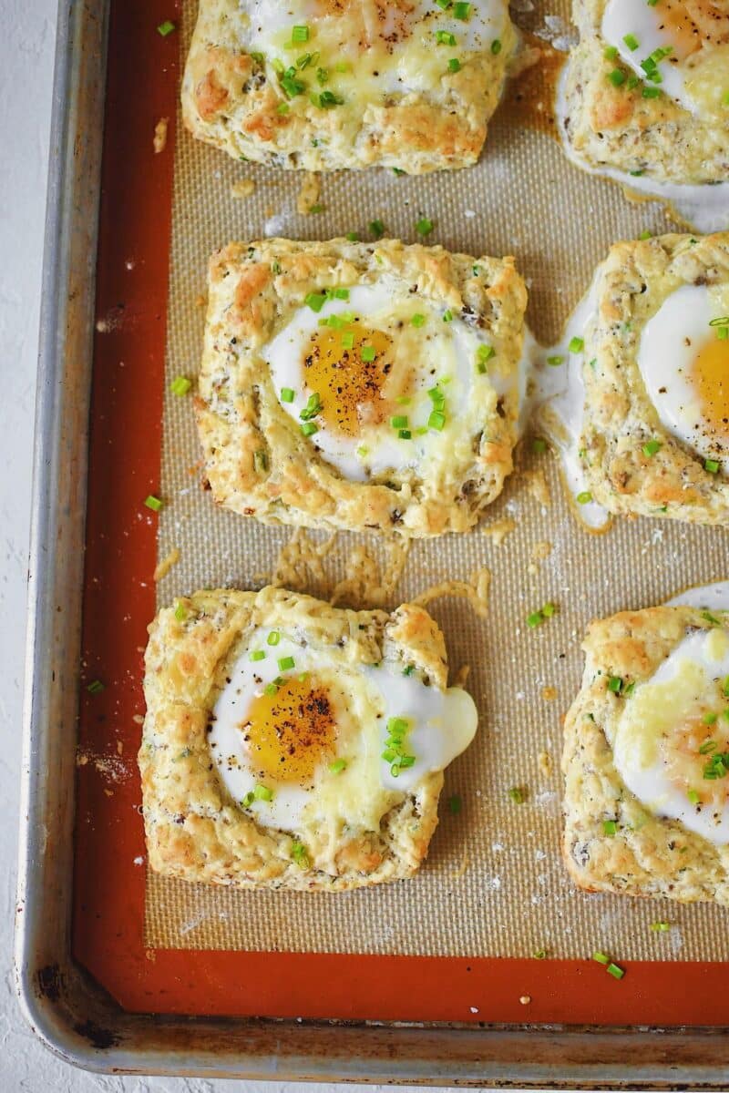 Sausage, Egg, and Cheese Biscuits just out of the oven and topped with chives.