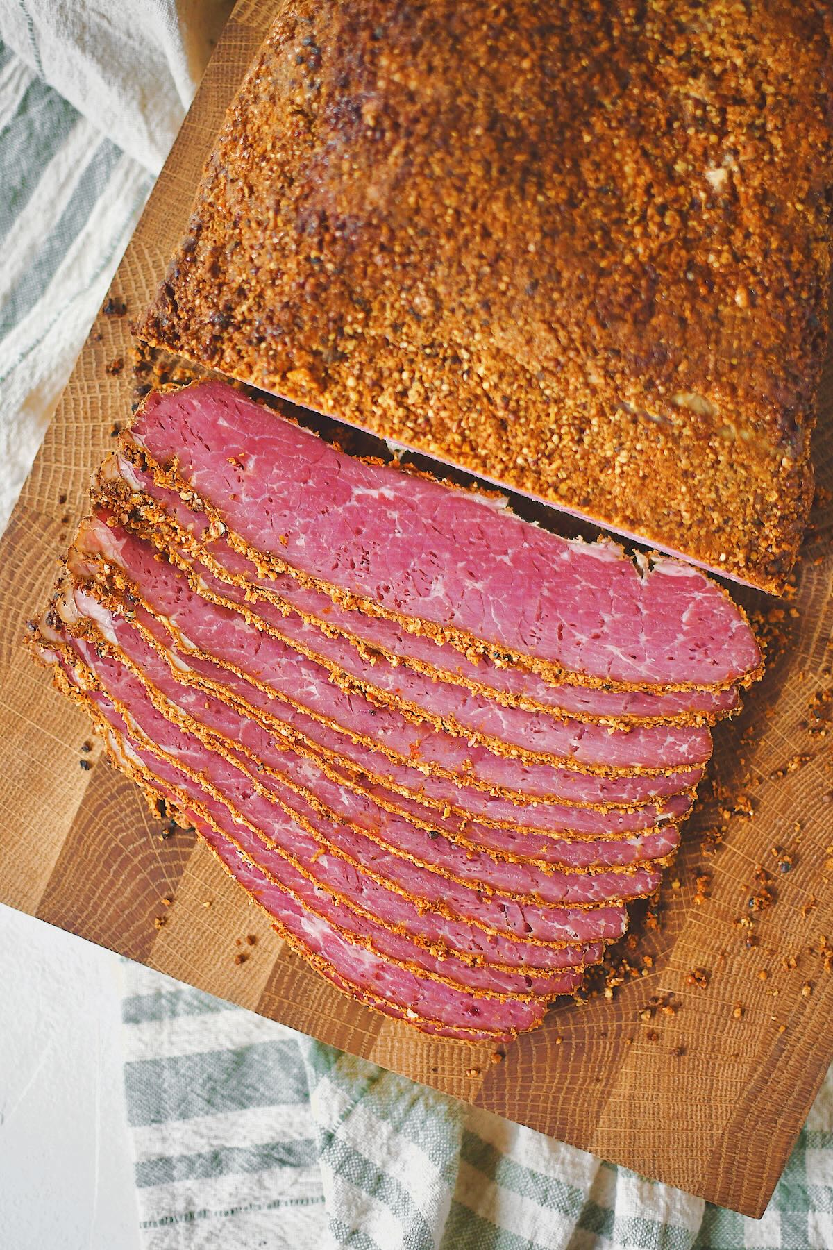 Slicing roasted and cooled homemade pastrami.