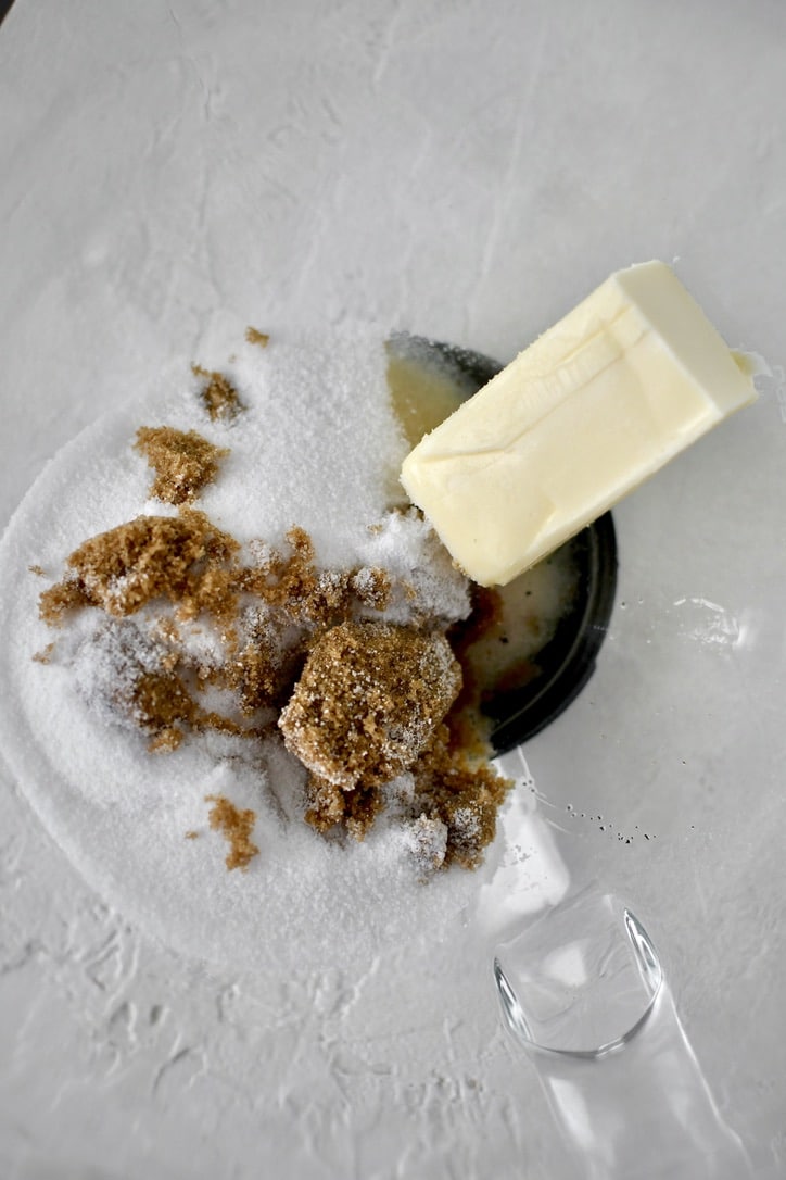 Butter, vanilla, and sugars in the bowl of a stand mixer before creaming.