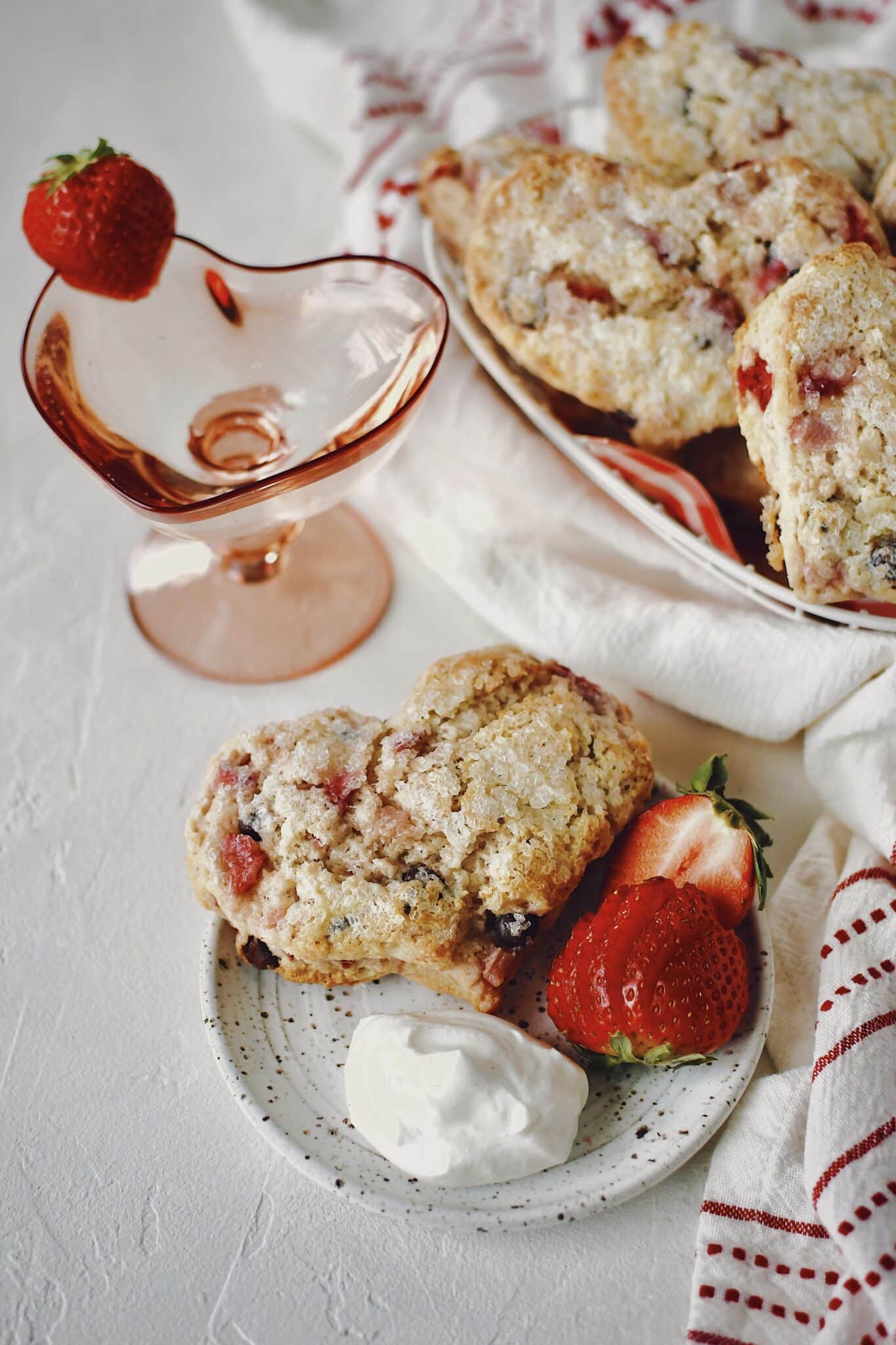 Strawberry Scones that have been cut into the shape of hearts on a plate ready to eat.