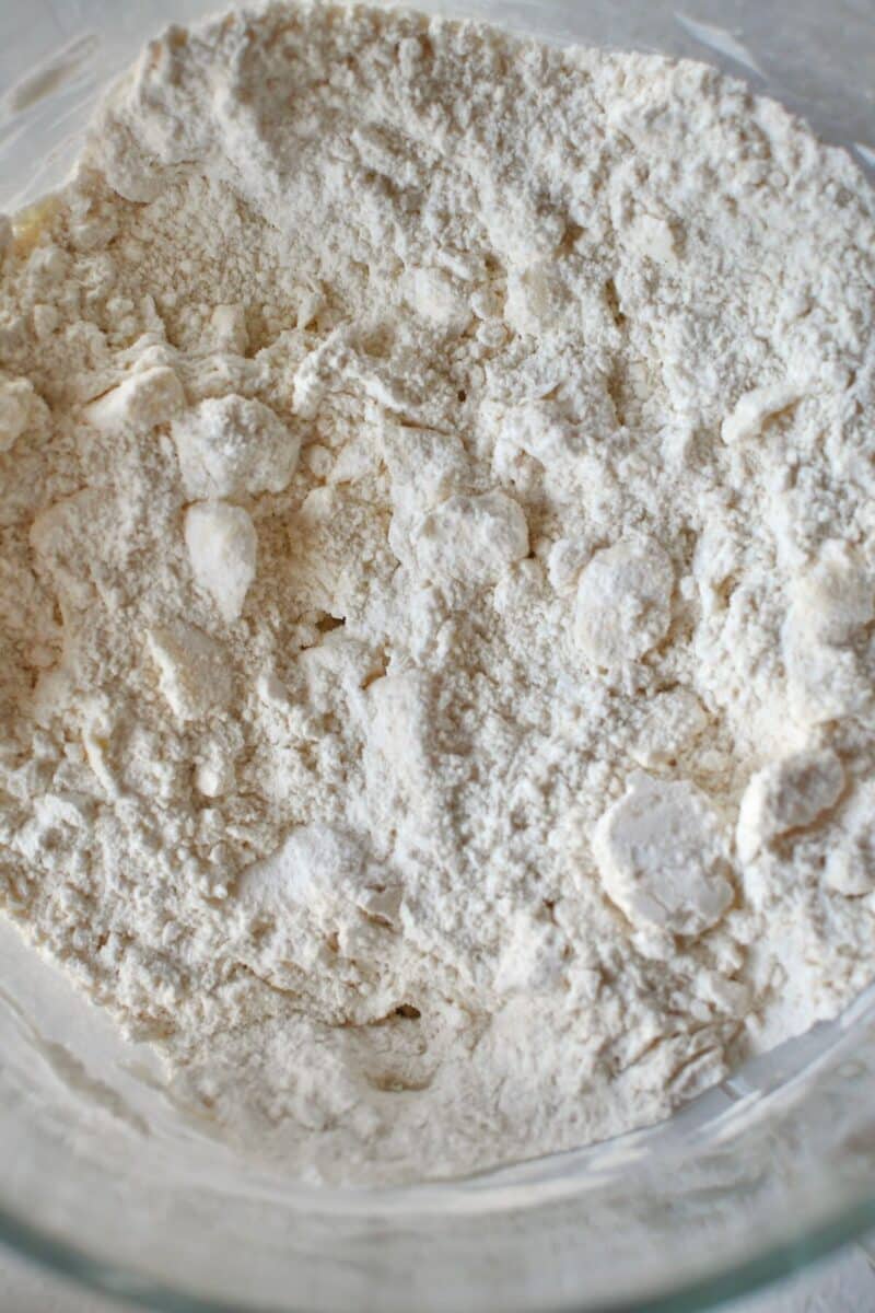 Flour and butter worked together to start biscuit dough.