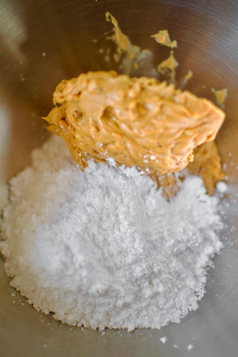 Powdered Sugar and Peanut Butter in a stand mixer bowl for the crumble topping.