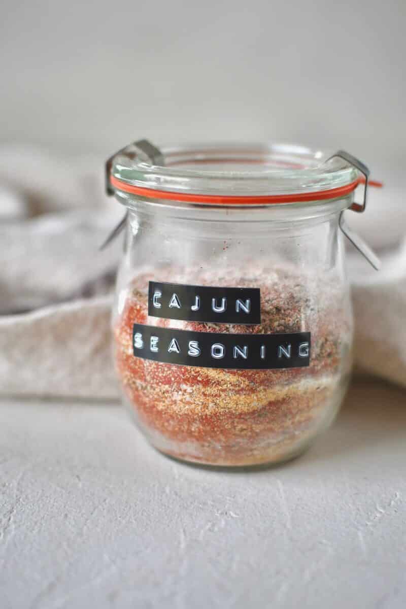 Ingredients for cajun seasoning in a jar, before shaking to blend.