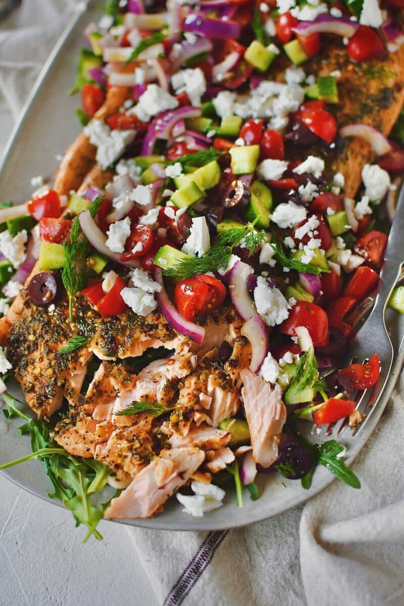 Greek Salmon topped with Greek salad topping of fresh veggies and feta cheese.