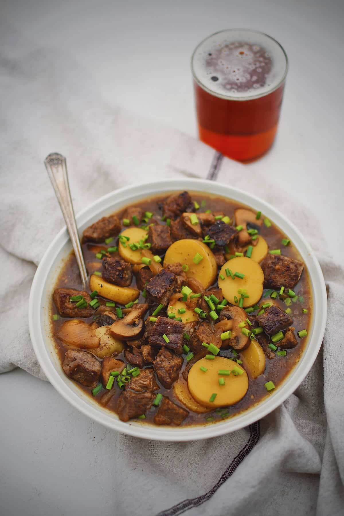 Steak and Potato Soup in a bowl ready to be eaten.