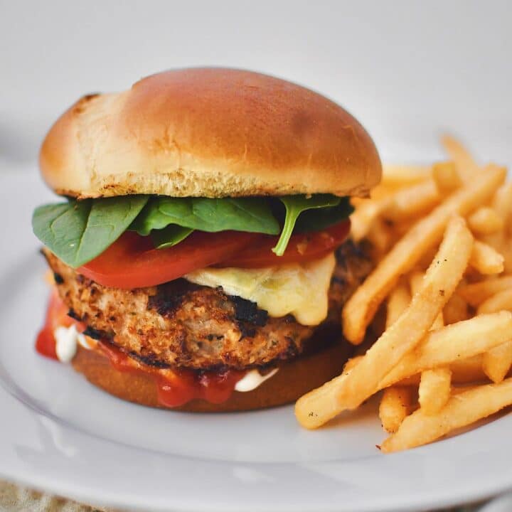 Assembled Turkey Burger on a plate with fries.