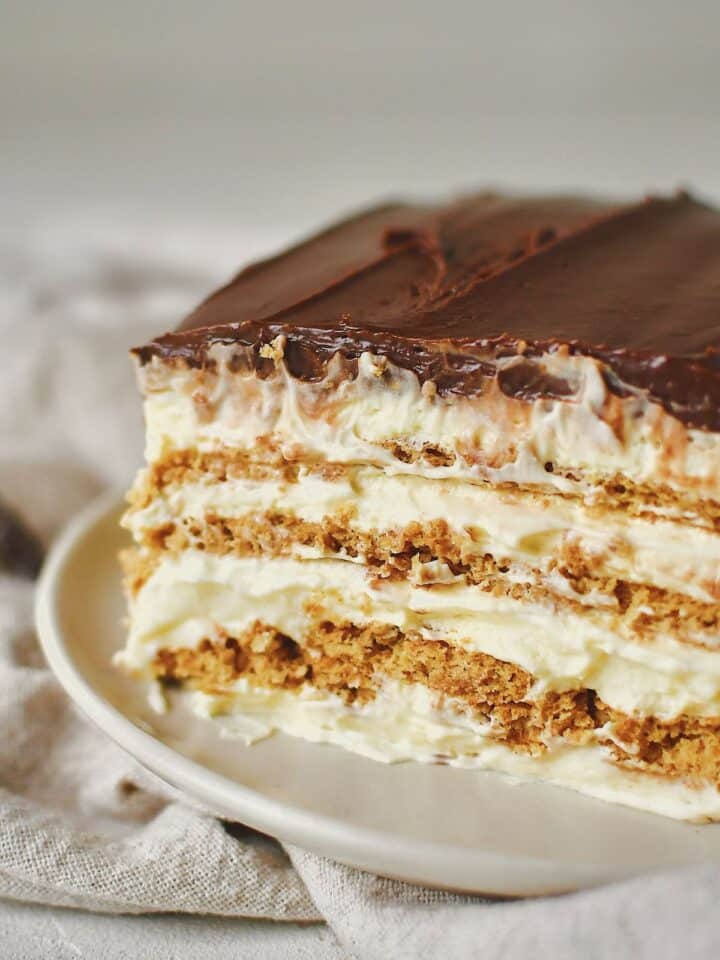 A slice of eclair cake on a plate ready to eat.
