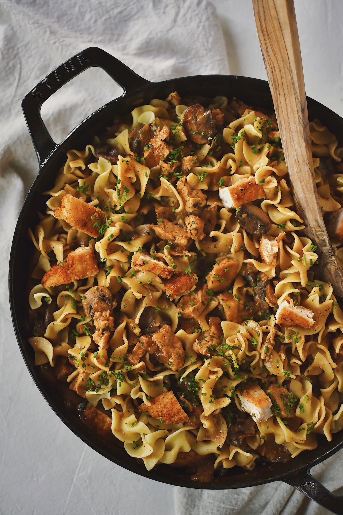 Chicken Stroganoff completed and tossed with the pasta in the pan, ready to dish out and eat.