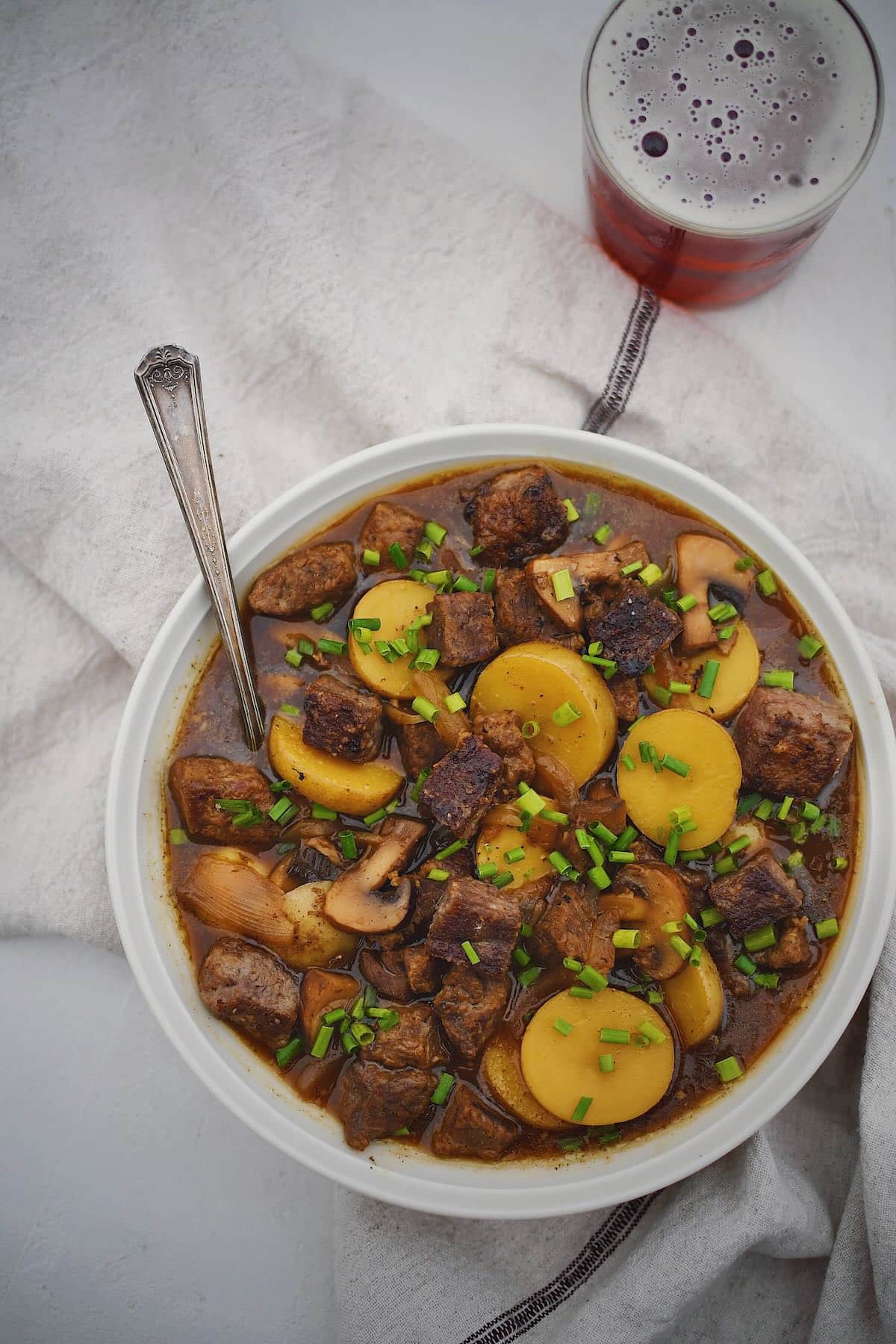 Steak and Potato Soup in a bowl ready to be eaten.