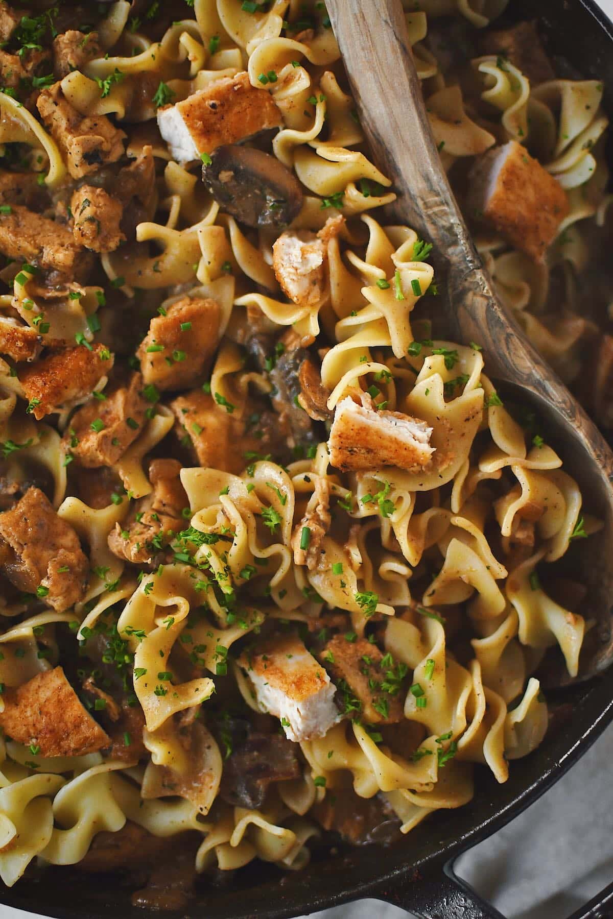 Chicken Stroganoff completed and tossed with the pasta in the pan, ready to dish out and eat.