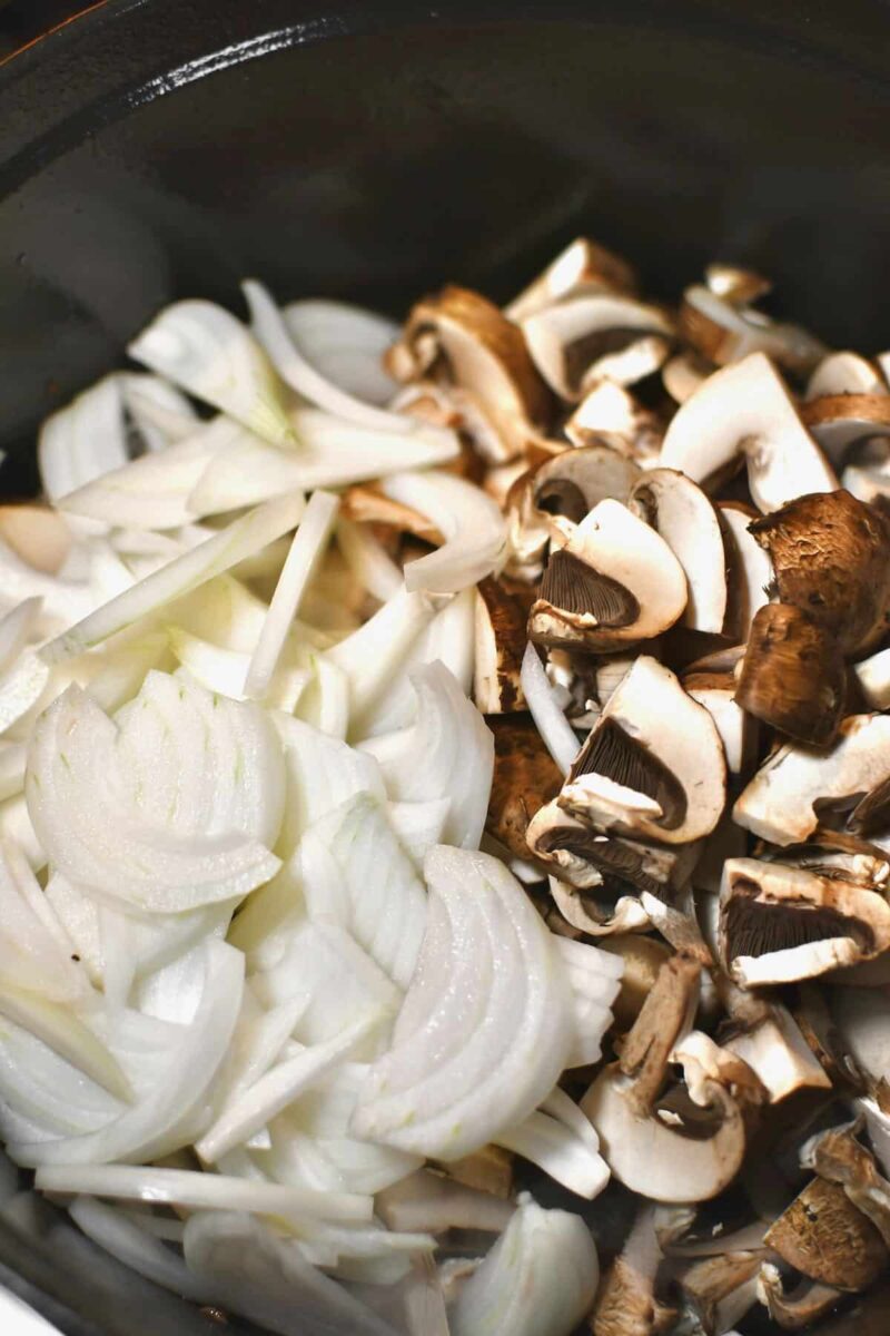 Adding the onions and mushrooms to the pan after the steak has been removed.