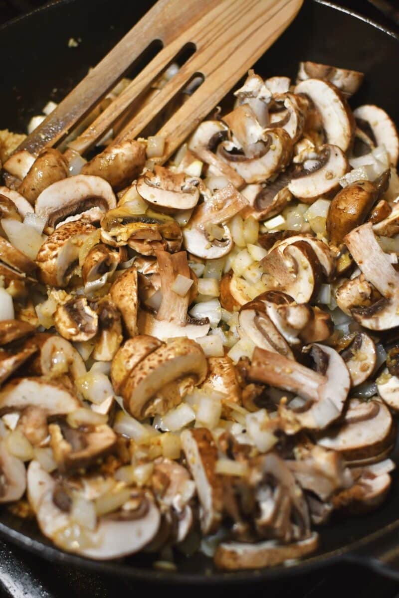 making the sauce, first cooking the mushrooms, onions, and garlic in butter.