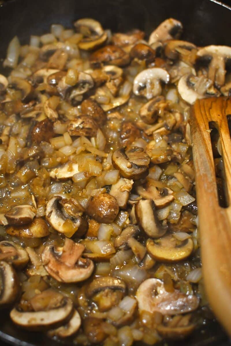making the sauce, first cooking the mushrooms, onions, and garlic in butter. Stage 2, mushrooms released their liquid.