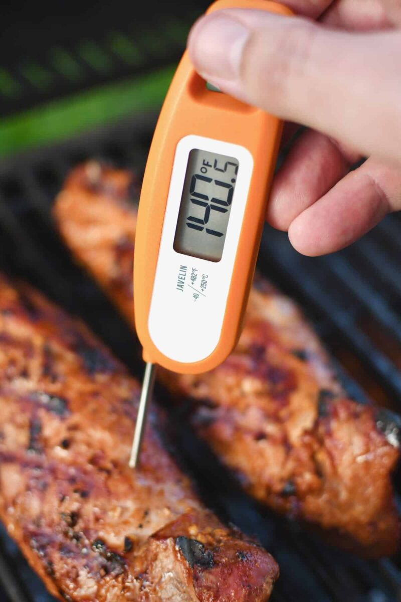 Checking the temperature of the pork tenderloins, reading a perfect 140˚F.