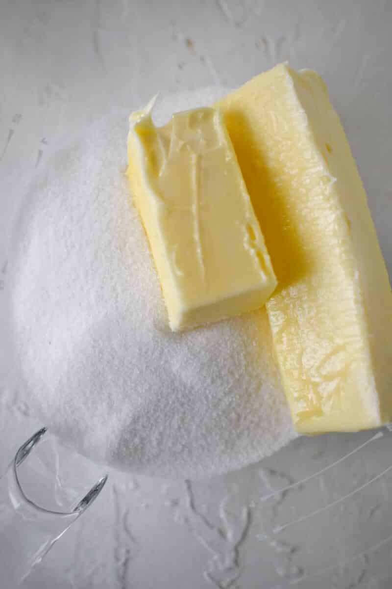 Sugar and butter added to a stand mixer bowl, ready to be creamed.