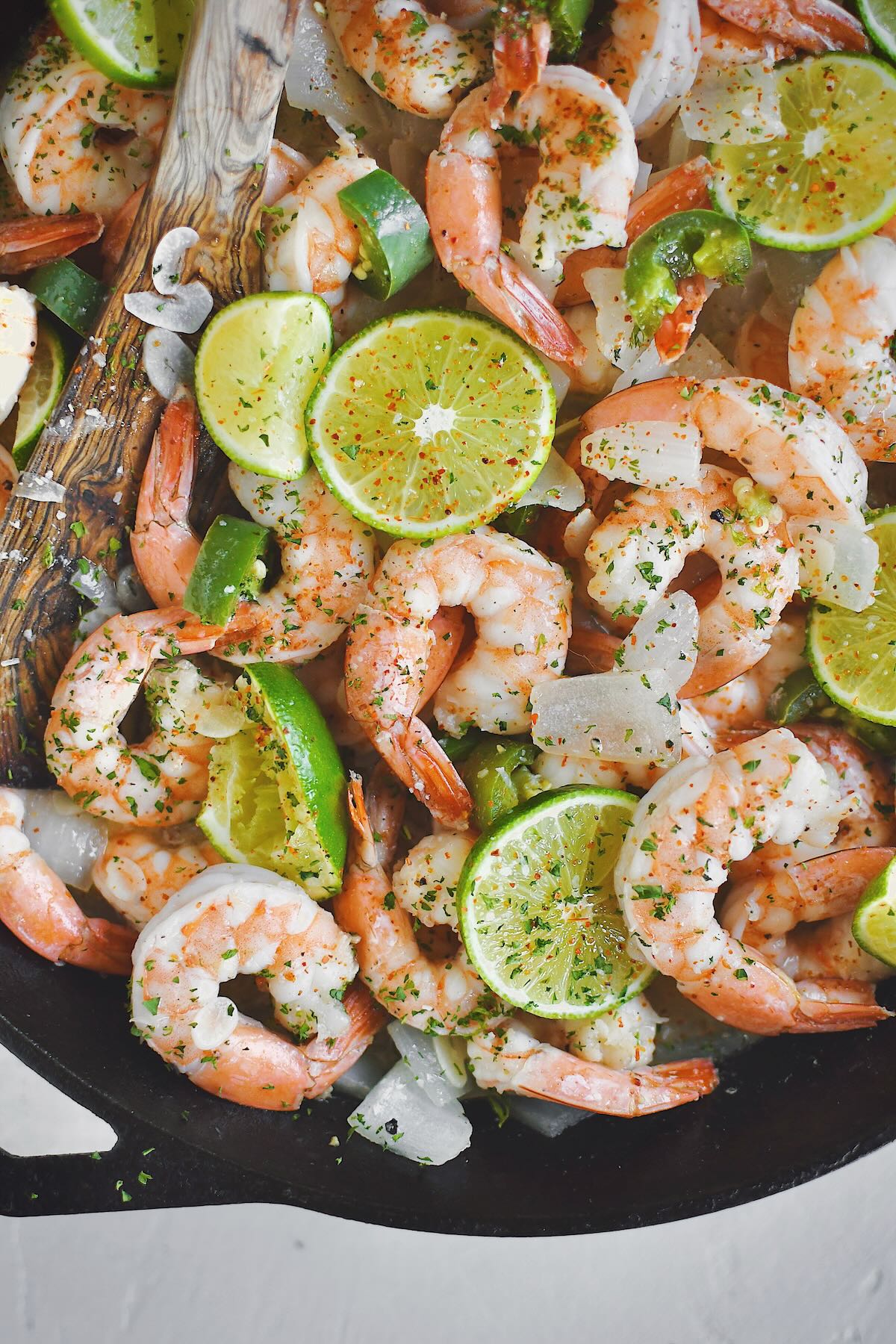 Cooked shrimp still in the pan staying warm, ready to eat.