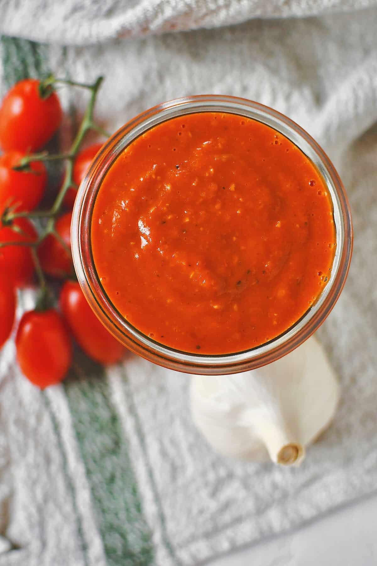 Roasted Tomato Vinaigrette that has been blended and is in a jar ready to be used.