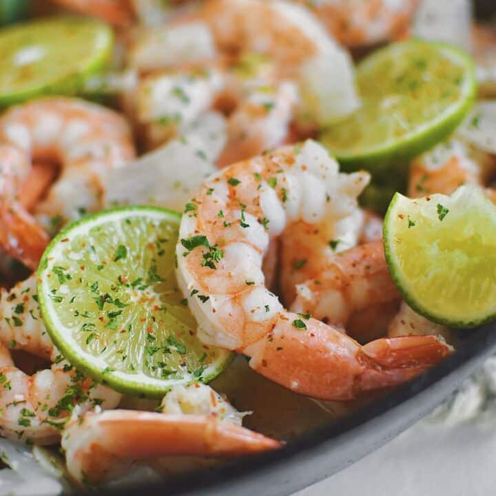 Cooked shrimp still in the pan staying warm, ready to eat.