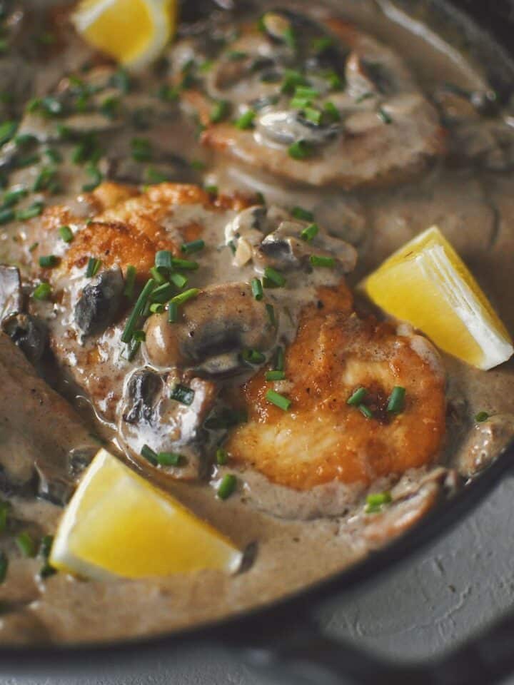 Creamy Mushroom Chicken, finished in the pan and topped with chives and a squeeze of lemon.