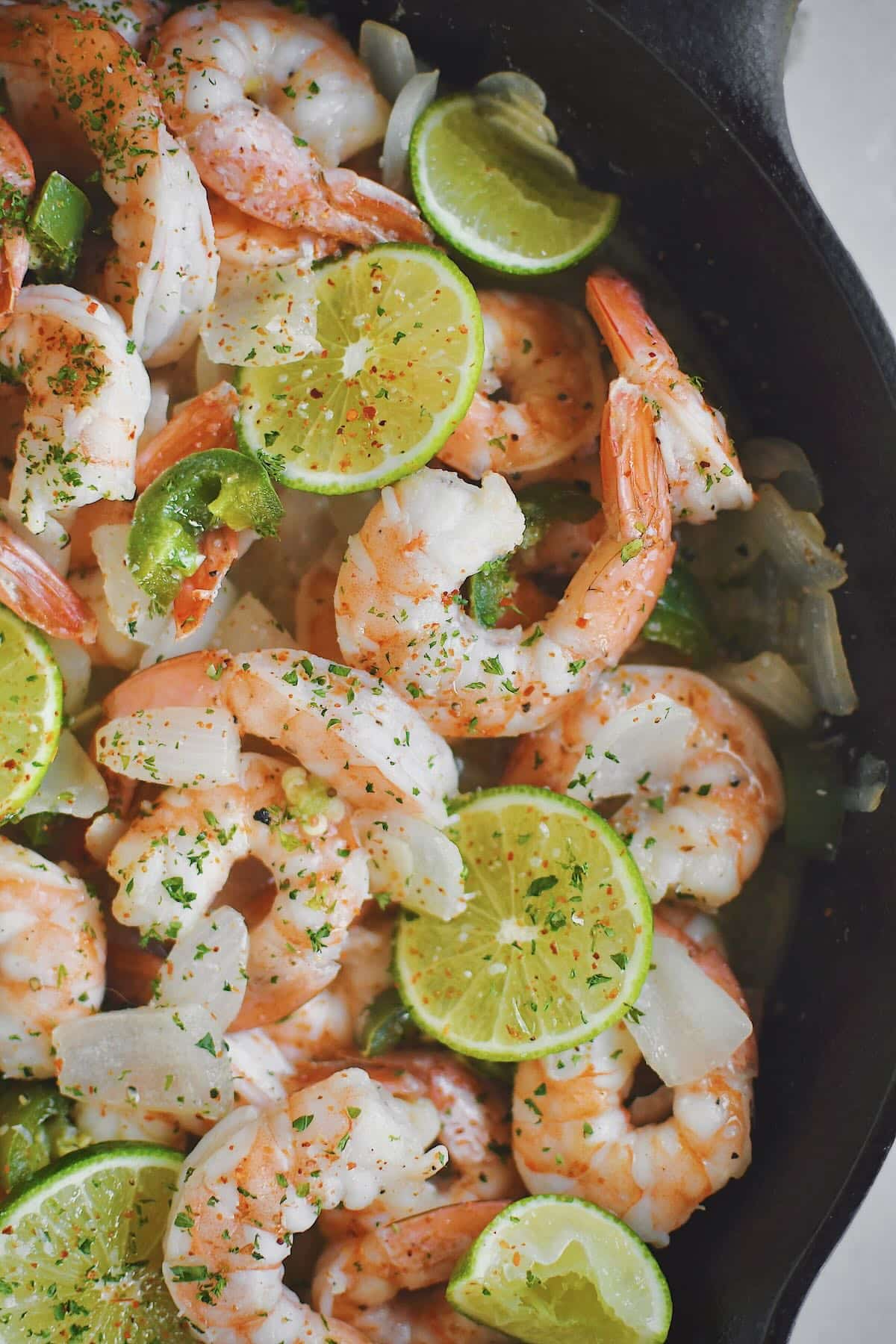 Cooked shrimp still in the pan staying warm, ready to eat.