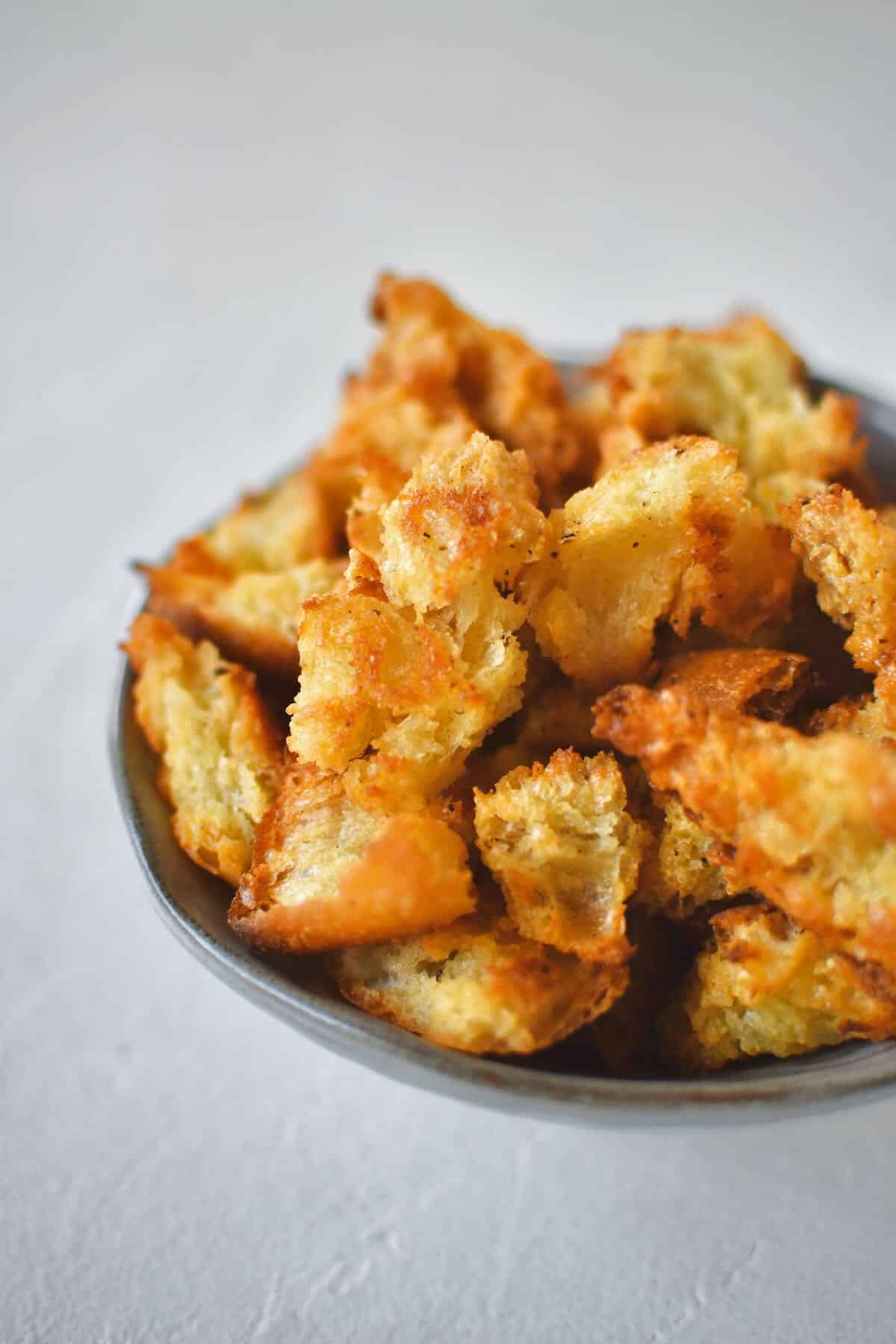 Homemade Croutons in a bowl ready to be used in a fresh salad.