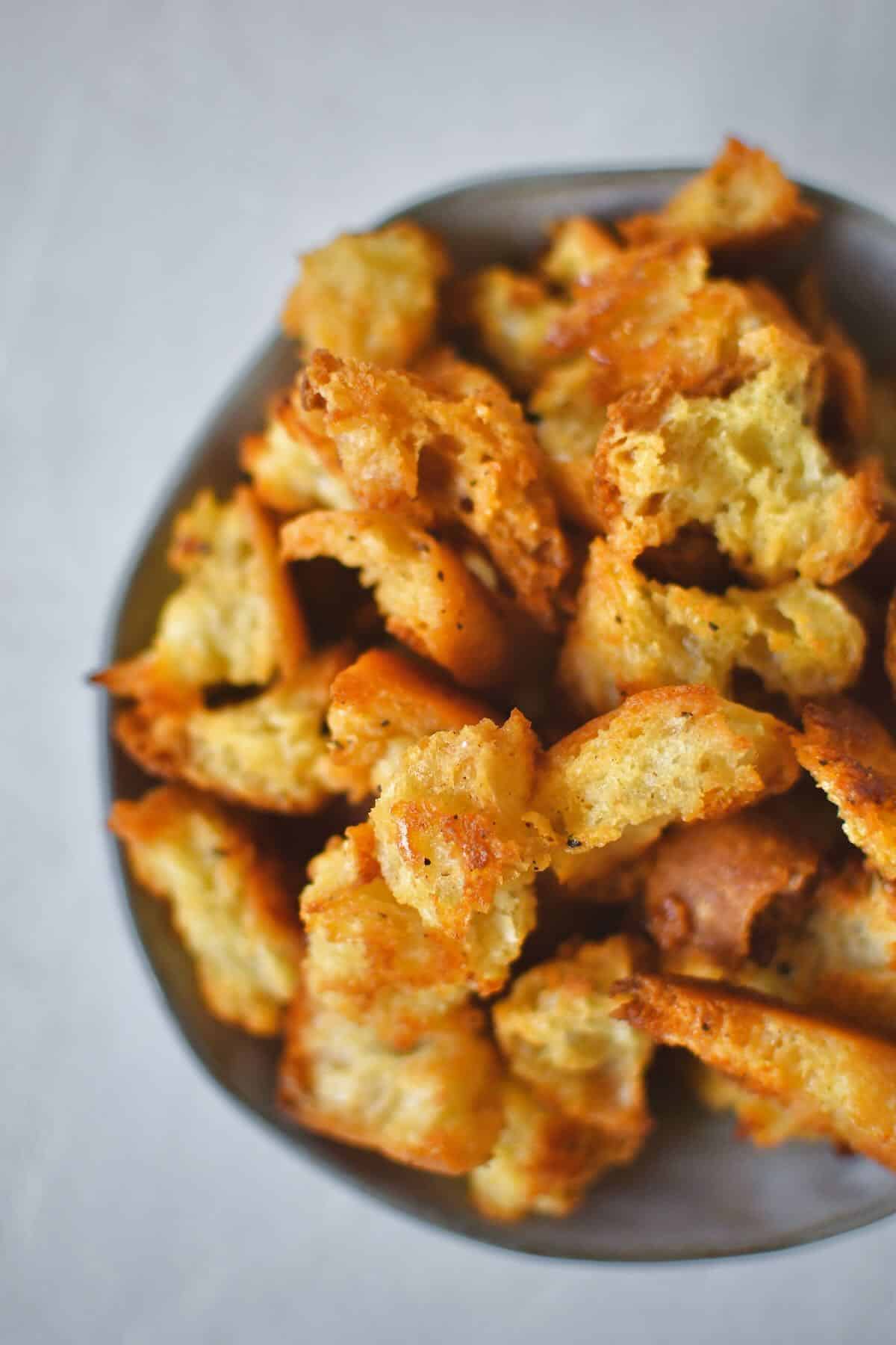 Homemade Croutons in a bowl ready to be used in a fresh salad.