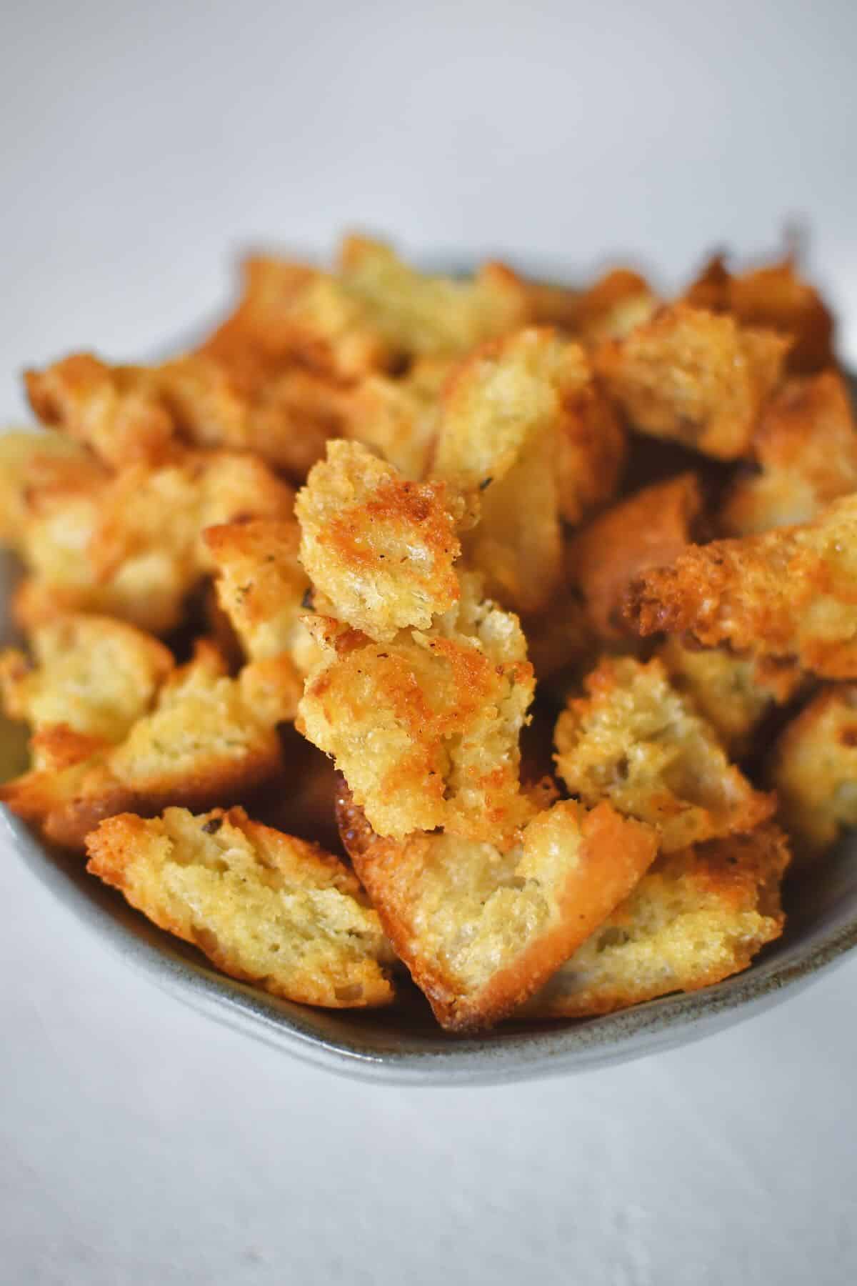 Homemade Croutons in a bowl ready to be used in a fresh salad.