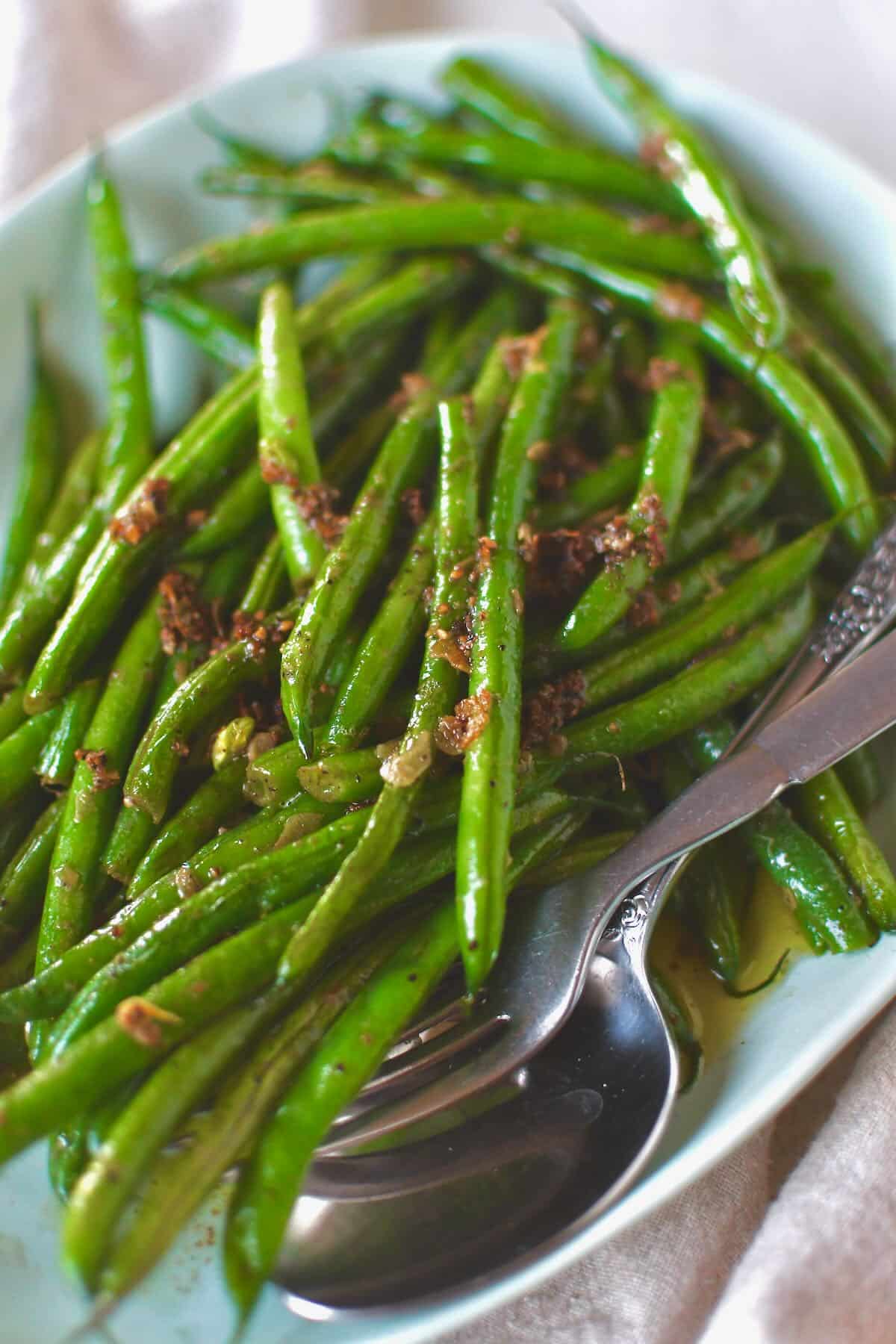 Sautéed Green Beans fresh out of the skillet with all the cooked garlic bits on top.