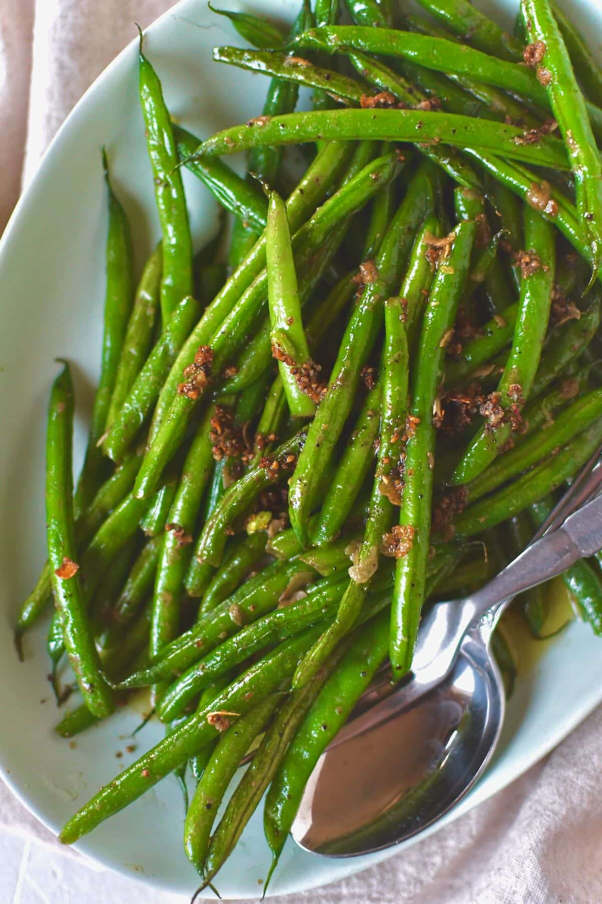 Sautéed Green Beans fresh out of the skillet with all the cooked garlic bits on top.