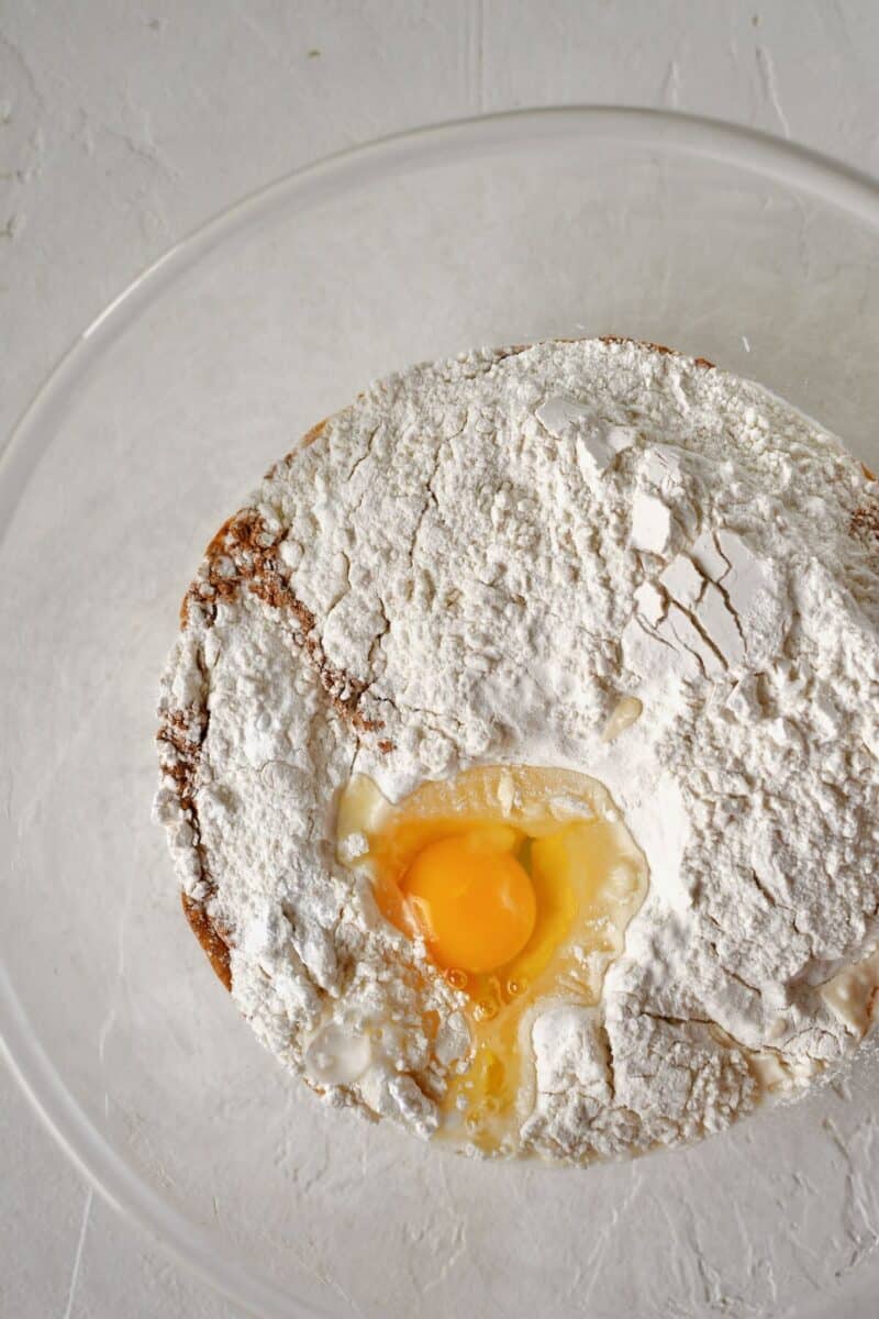 Adding all the ingredients into a bowl to make the pancake batter.