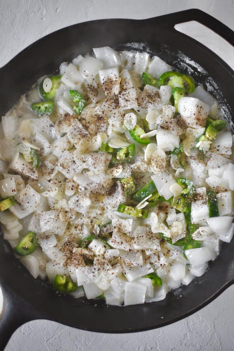 Cooking the onions, garlic, and jalapeno in butter as the first step.