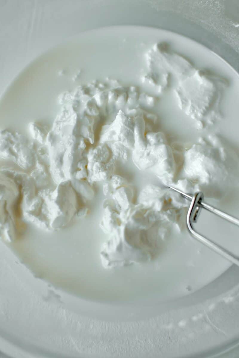 Whisking together the sour cream and milk.