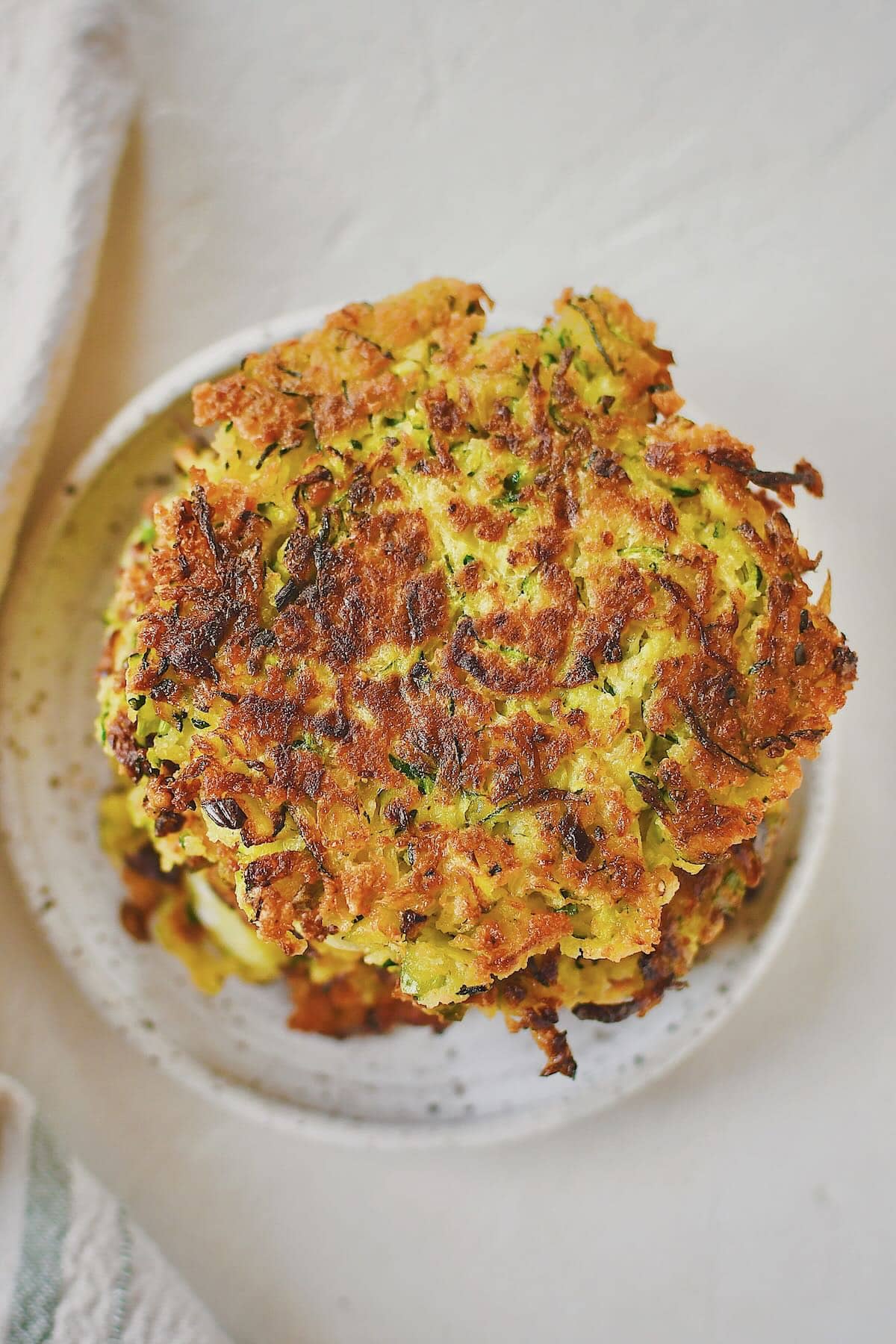 Crispy golden zucchini fritters ready to be devoured.