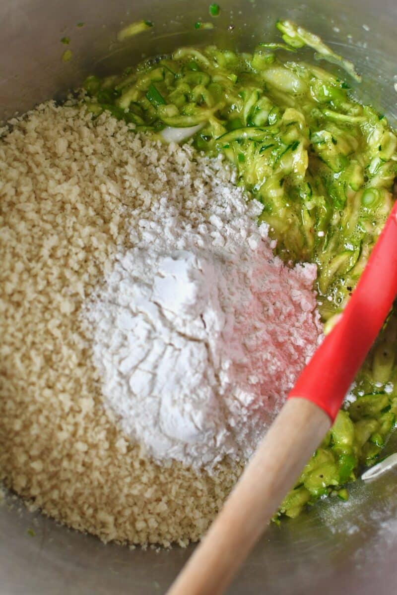Adding the panko and flour to the zucchini and wet ingredients.